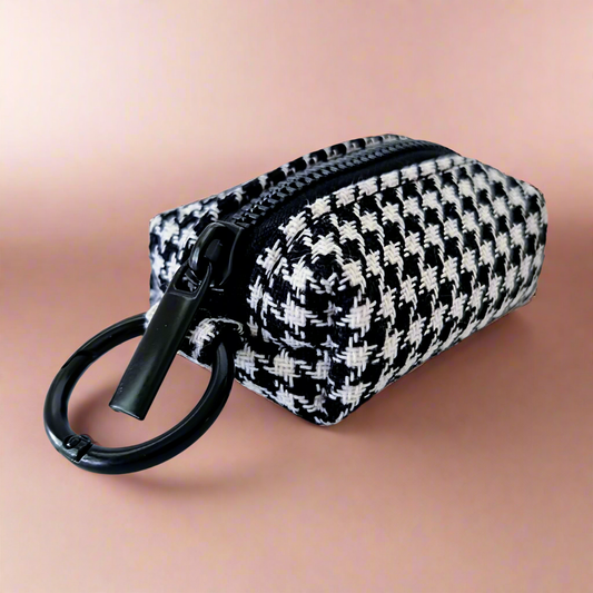 Dog poop bag holder with houndstooth pattern