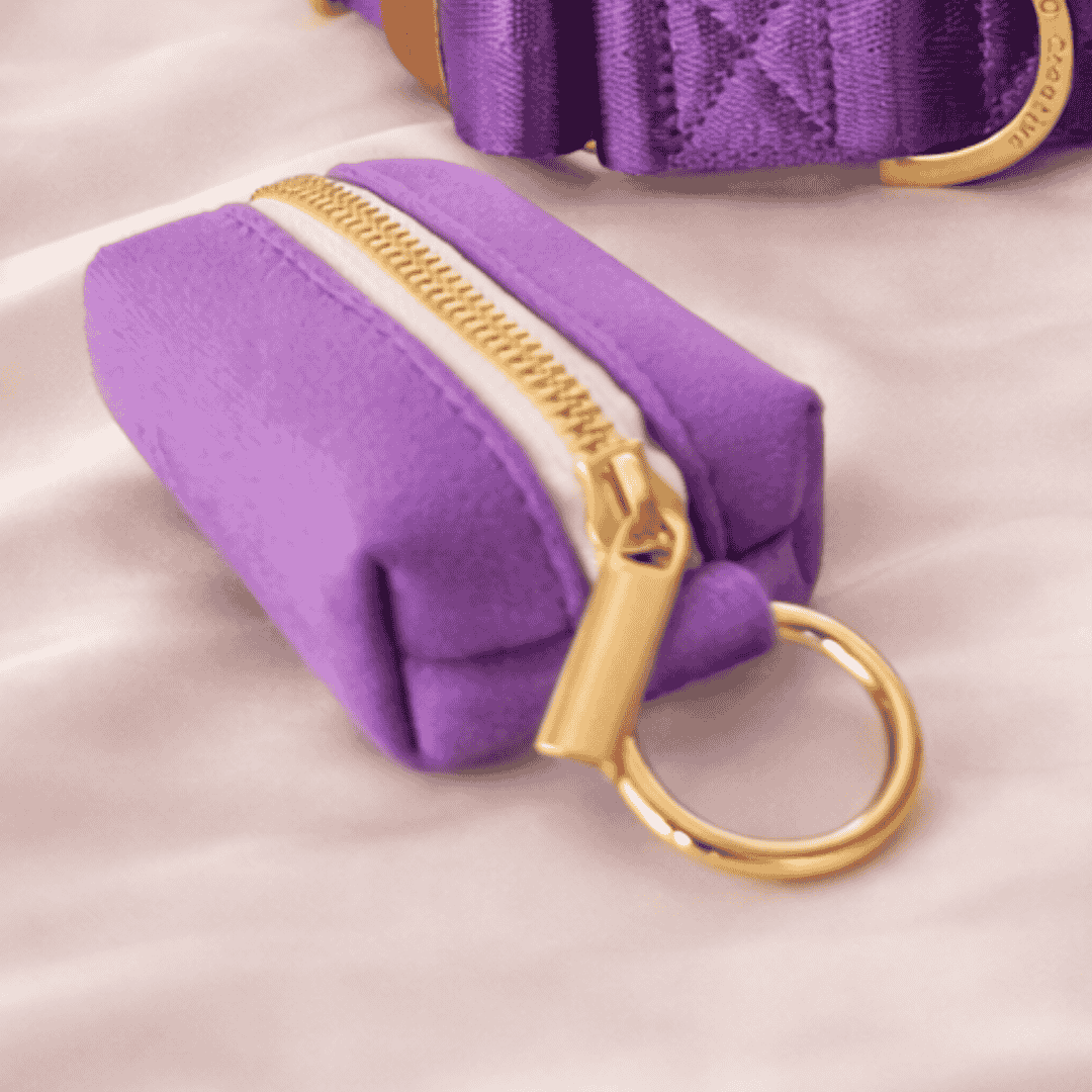 purple dog poop bag holder with gold zip