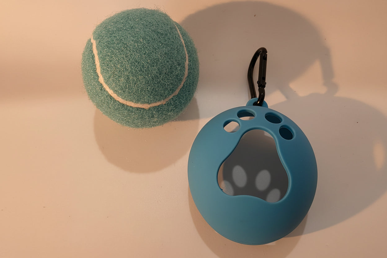 Light blue tennis ball and clip on holder