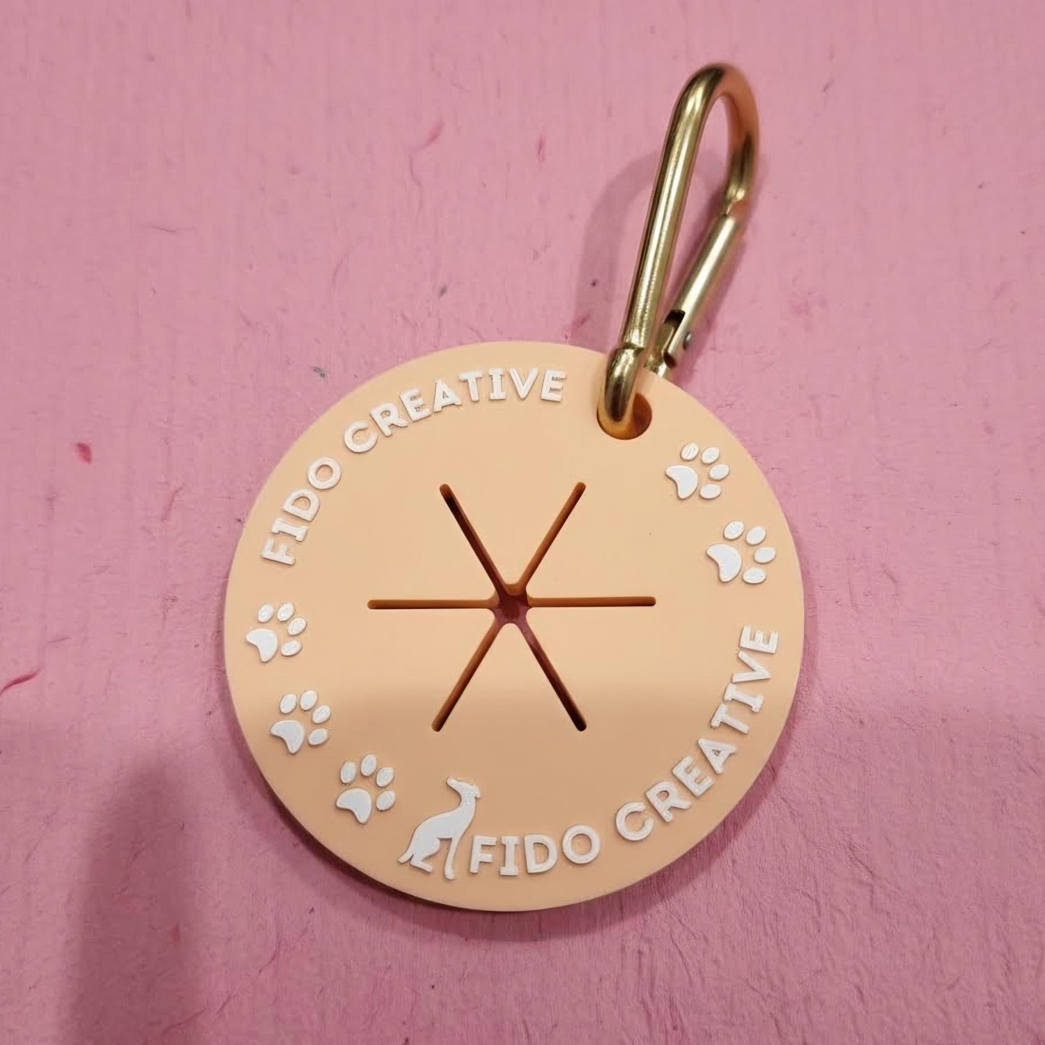 Round used dog waste bag holder with 'Fido Creative' branding
