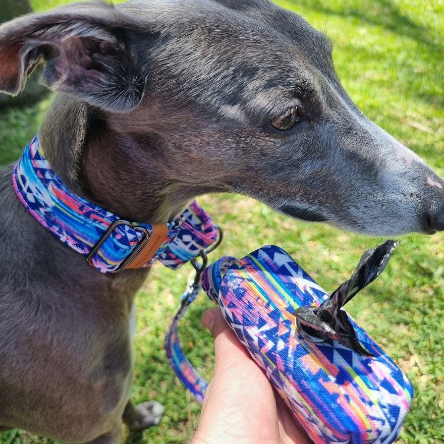 a close up of a dog on a grass field 